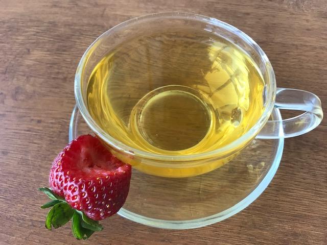 cup of tea with strawberry